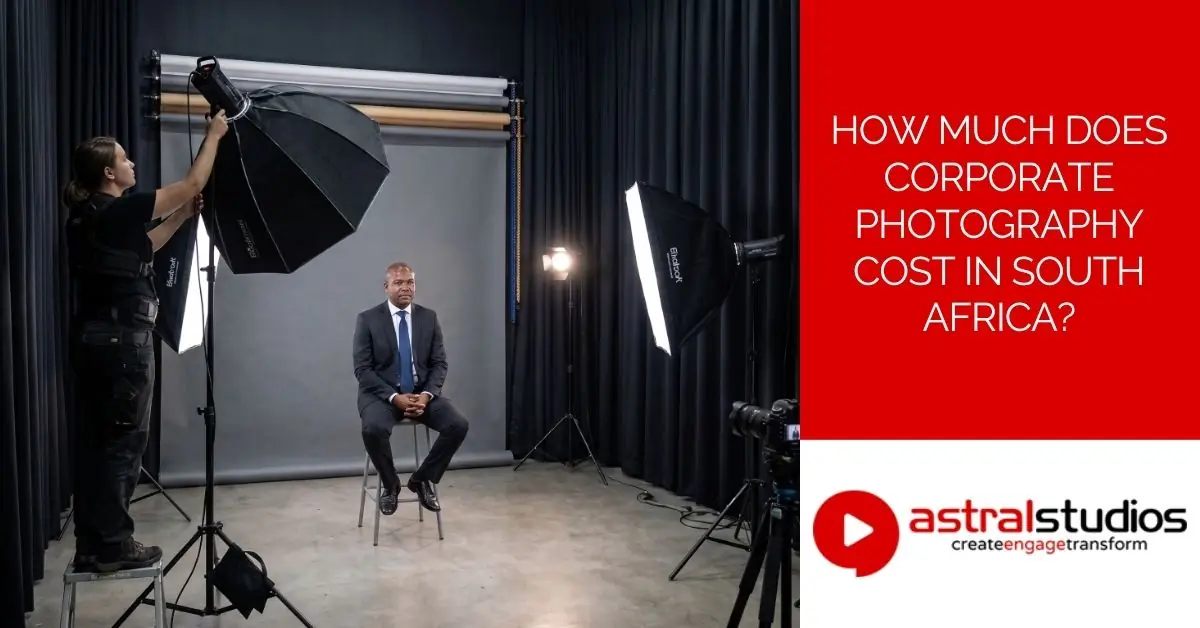 Photographer setting up three-point studio lighting for a corporate headshot session in South Africa
